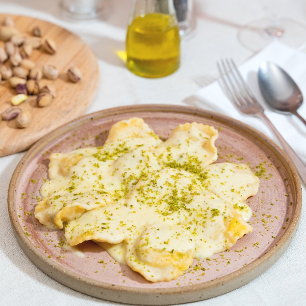 Seabass Caper and Olive Ravioli, Lemon Sauce and Pistachio